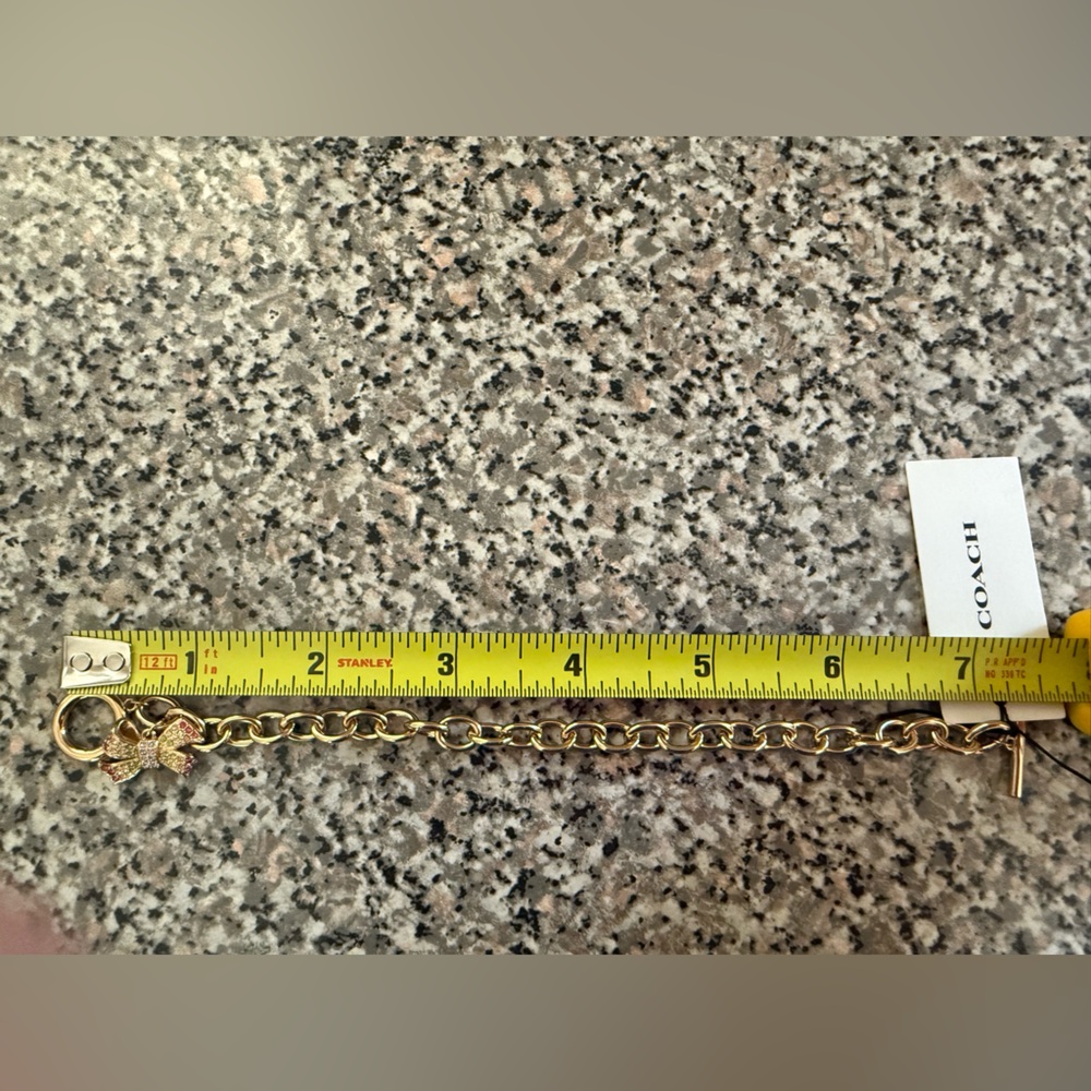 Coach Gold Bracelet with Multicolor Gem Encrusted Bow Charm New in Box - Picture 6 of 7